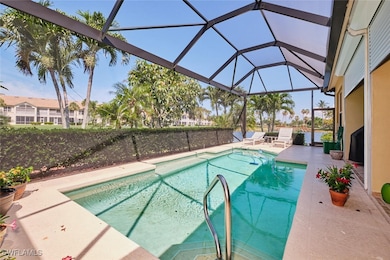 Outdoor pool with a patio and glass enclosure