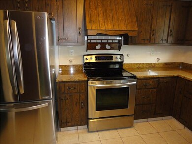 Stainless steel appliances compliment the granite 