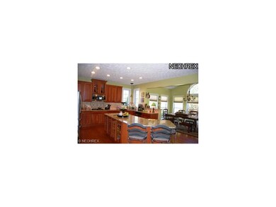 View of gourmet kitchen and bright morning room.