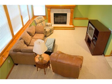 living room w/fireplace and ceiling fan