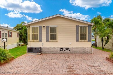 Back of house with central air condition unit and