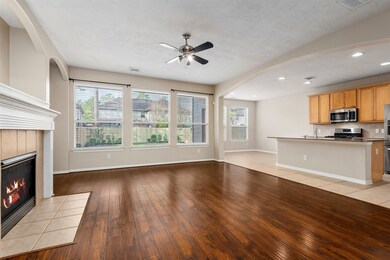 Huge den with hardwood floors and a wall of window