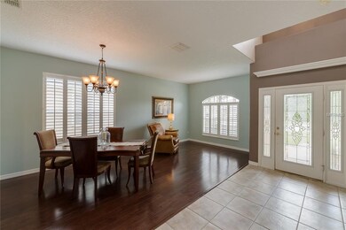 Formal dining and living areas with plantation shu