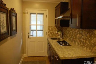 Located adjacent to Kitchen, single sink, Hood and