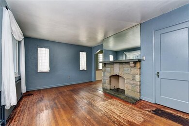 Stone fireplace and closet in nice sized living ro
