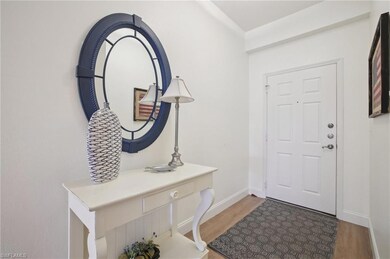 Foyer entrance featuring light wood finished floors