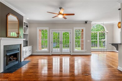 Living room and breakfast nook showing spectacular lush treescape