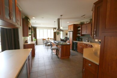 Notice the beautiful custom cabinets, abundance of