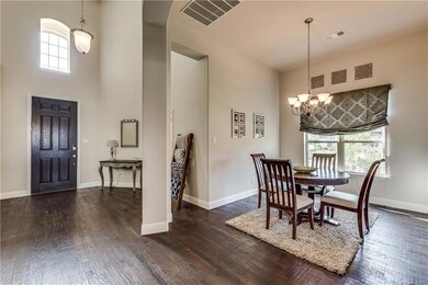 Open arches lead to your formal dining space