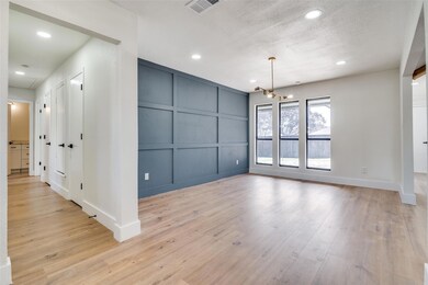 Spare room featuring light hardwood / wood-style f