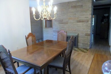 Fieldstone fireplace in Dining