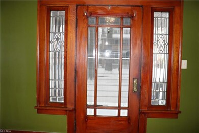 Stunning original beveled glass front dr.