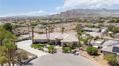 Aerial perspective of suburban area with a mountain backdrop