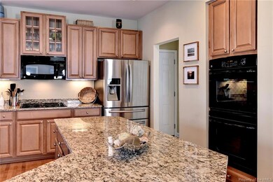 The kitchen offers tons of work and storage space, including a pantry.