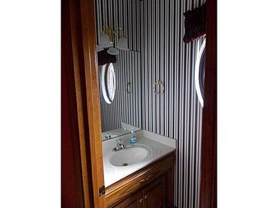 Bathroom. This guest bath sits just off the entryw