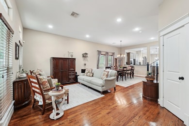 You enter into the beautiful living room and formal dining room.