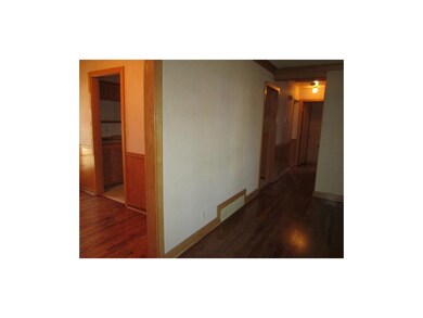 Split view of hallway off living room and dining r