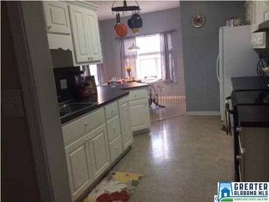 Kitchen offers a breakfast bar and dining area