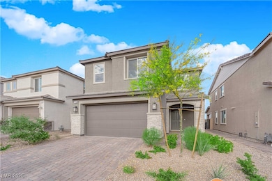 Traditional-style home with decorative driveway, a