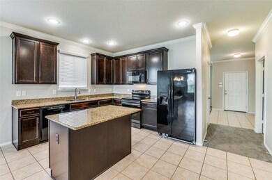 Primary ensuite bathroom features dual sinks, soak