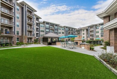 View of home's community featuring a lawn and a pa