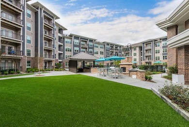 View of home's community featuring a lawn and a pa