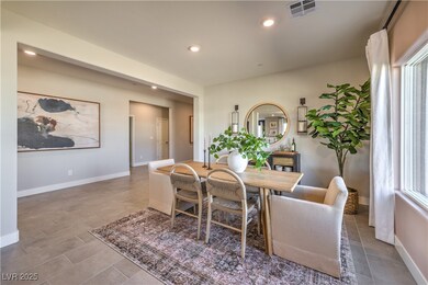 Dining space with recessed lighting and baseboards