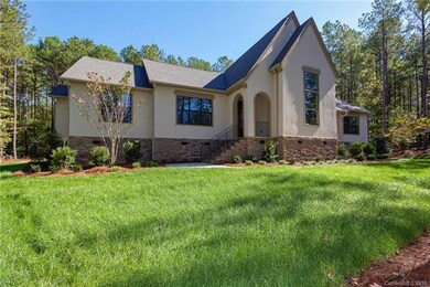 Stucco and brick combine to create a charming exte