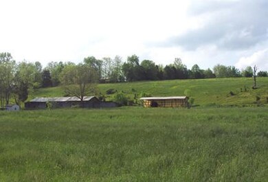 Choice land with good buildings.  Land is level up front and gently rolling all over. 2 creeks, pond, Fenced and cross fenced. Small wooded hollow to give shade for livestock.