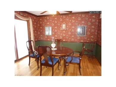 Formal Dining, Hardwood Flooring,Sliders to Three Season Patio Enclosure.