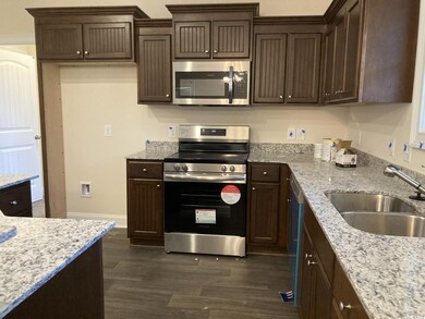 Kitchen with appliances with stainless steel finis