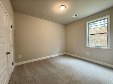 Unfurnished bedroom featuring a closet and carpet flooring
