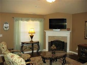 Another view of living room area with large window