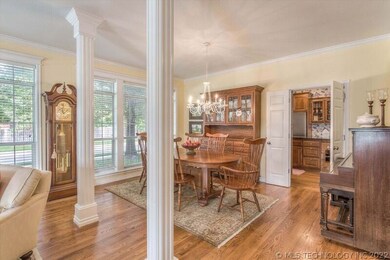Dining area w/ double doors leading to kitchen.