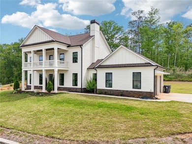 Greek revival inspired property with board and bat