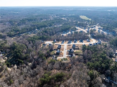 Aerial view featuring a view of trees