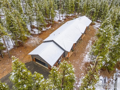 Aerial view of the home with extensive fire mitigation around the entire house.