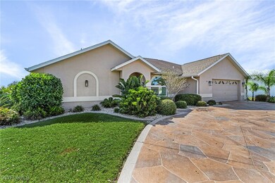Ranch-style home featuring a front lawn and a gara