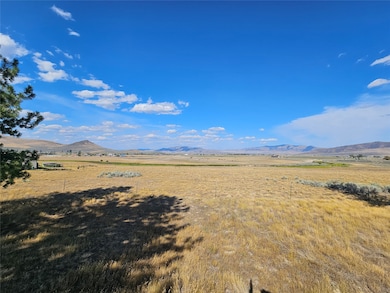 View of mountain background featuring rural landscape