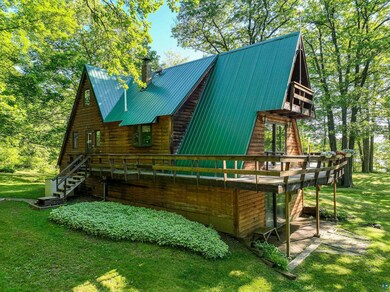 View of side of home with a lawn