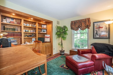 Directly off of the foyer you'll find the study with custom oak cabinetry including bookcases and storage.