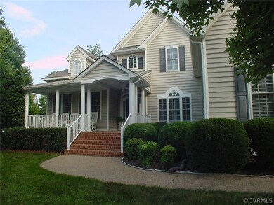Covered front porch, a metal roof & brick steps