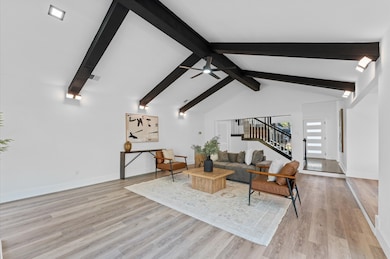 Living room has new flooring an abundance of natur