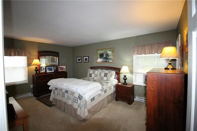 Large master bedroom with an attached bath and a w