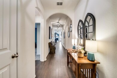 Hall with dark hardwood / wood-style flooring
