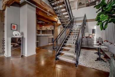 Staircase featuring a towering ceiling and flex sp