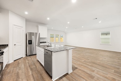 Island Overlooks Family and Dining Space