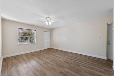 Unfurnished room with light wood finished floors and ceiling fan