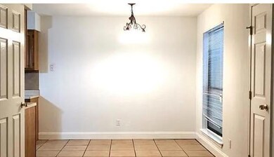Unfurnished dining area featuring light tile patt