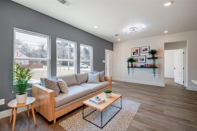 Living room featuring recessed lighting, visible v